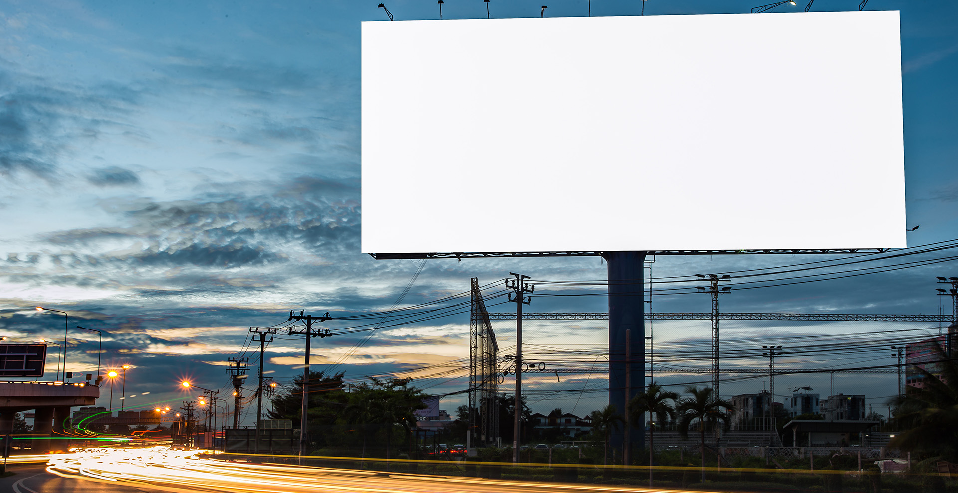 white blank billboard next to highway