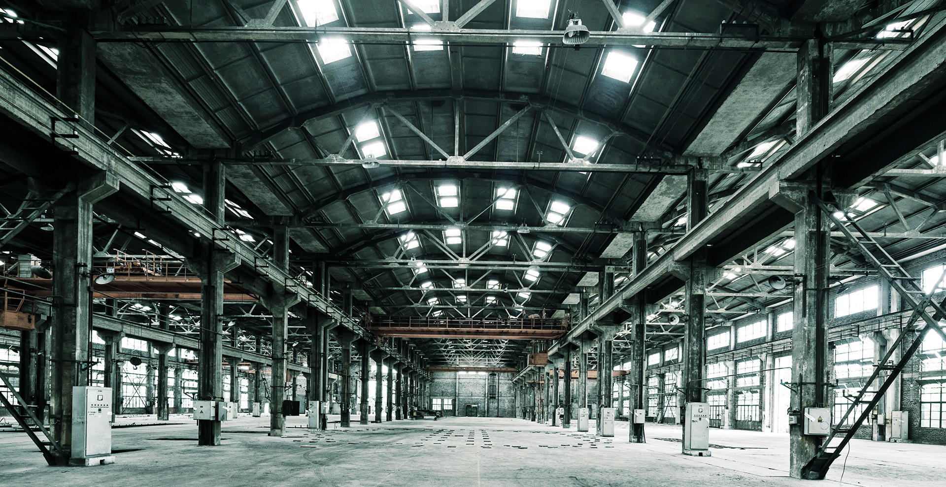 large industrial space with open floorplan and windows