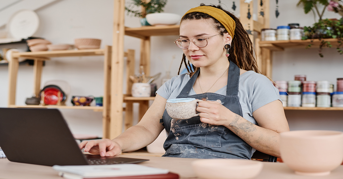 woman-business-owner-drinking-coffee-on-computer