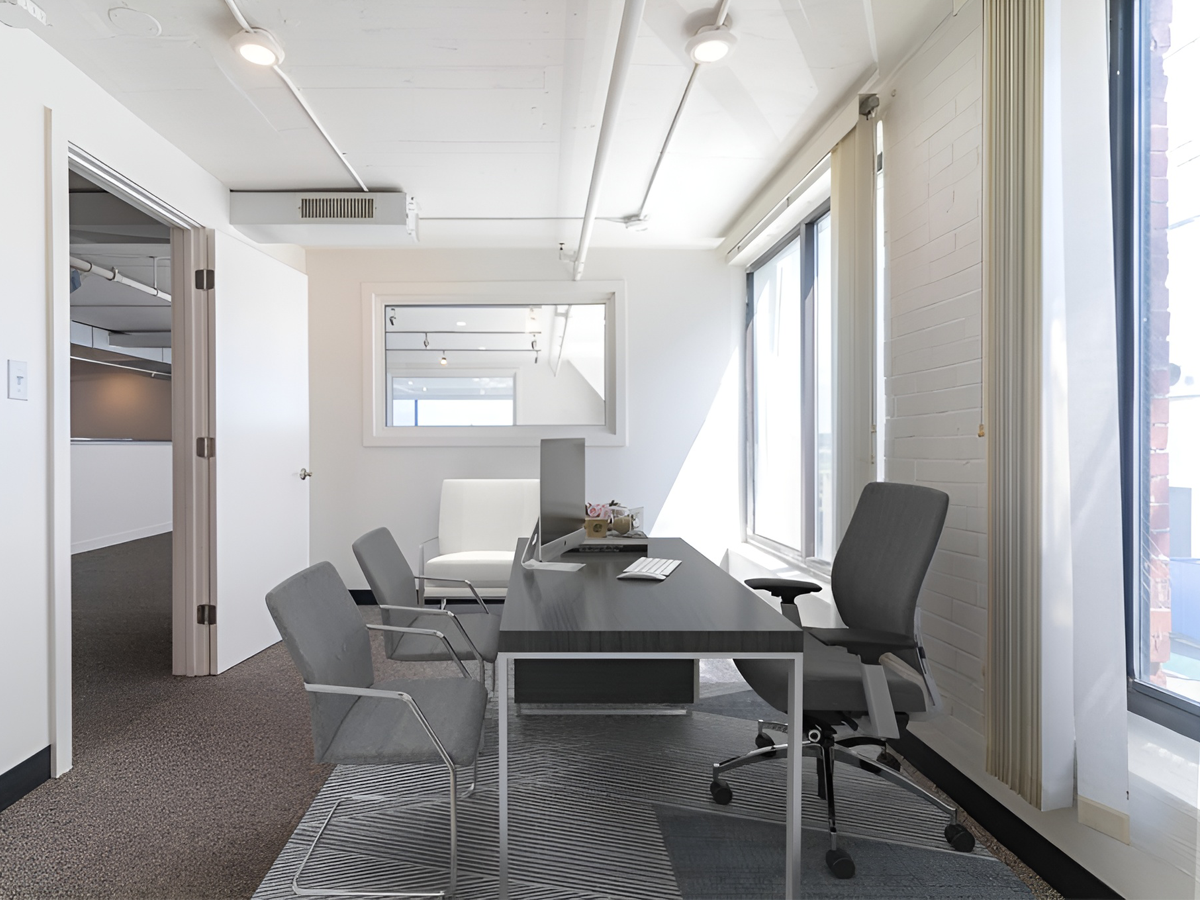 private office staged with desk and chairs