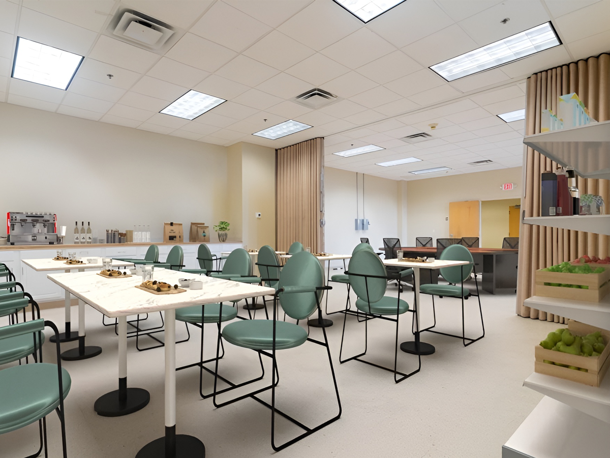 event area staged as cafe space with tables and chairs