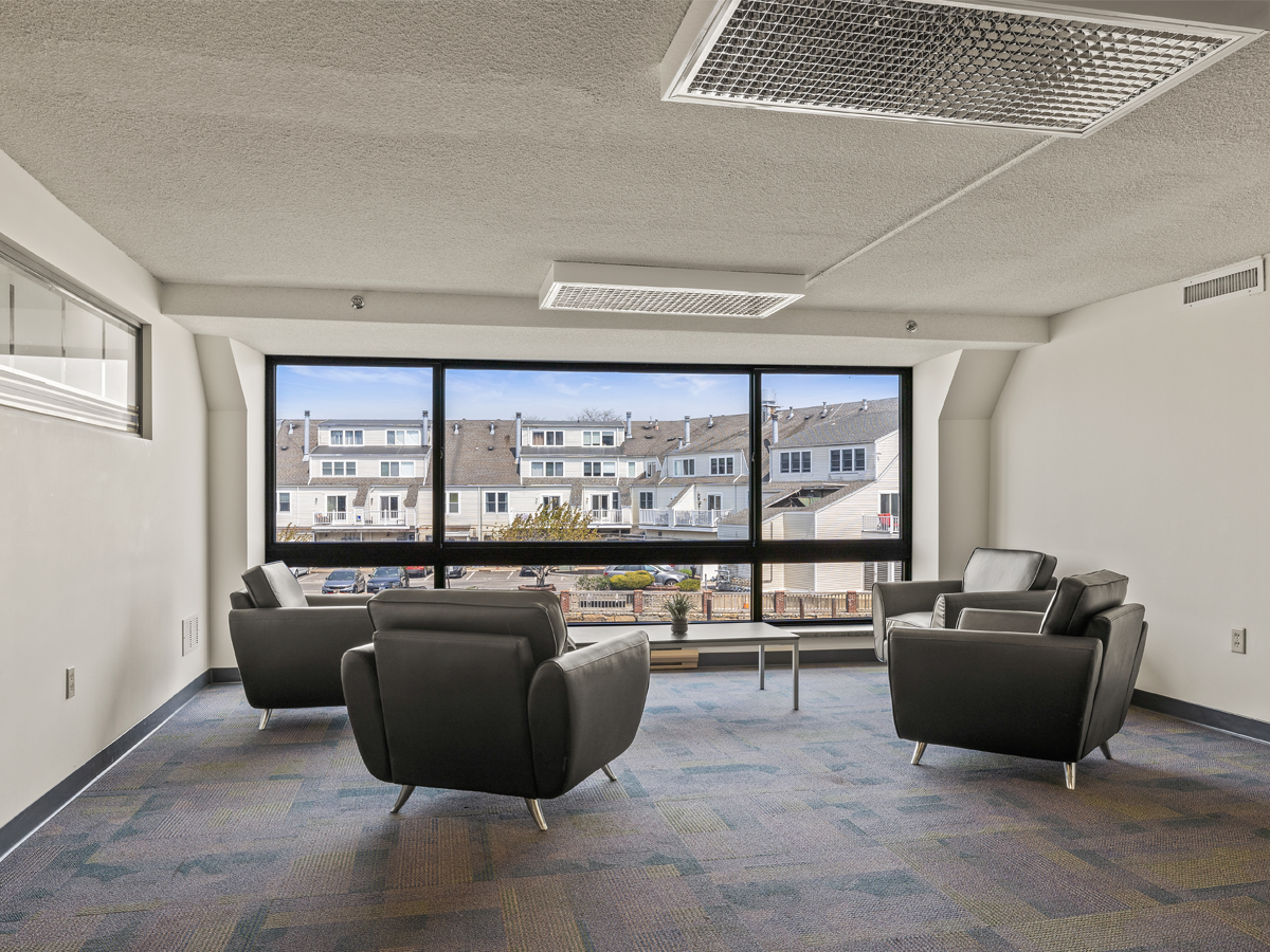 sitting area with lounge chairs and table