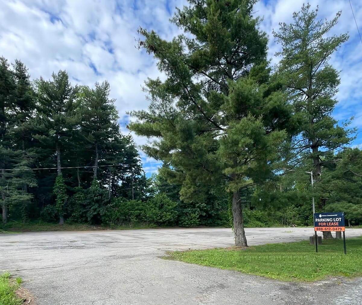Plot of land with Parking Lot For Lease sign