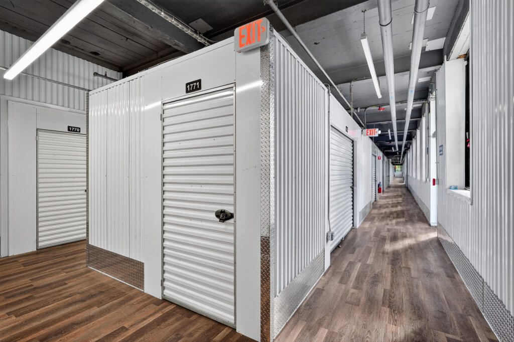 storage facility hallway with white roll-up doors