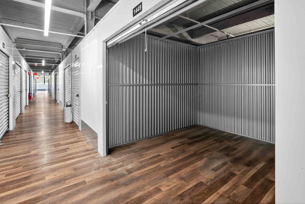 storage facility hallway with larger unit door rolled up