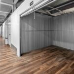 storage facility hallway with larger unit door rolled up